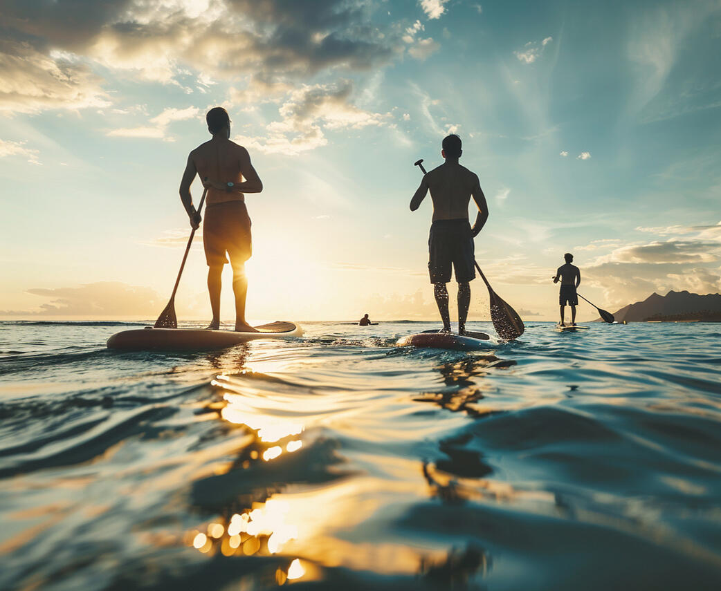 A Group of Men Paddleboarding